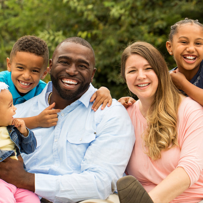 Beautiful smiling family with diverse skin tones