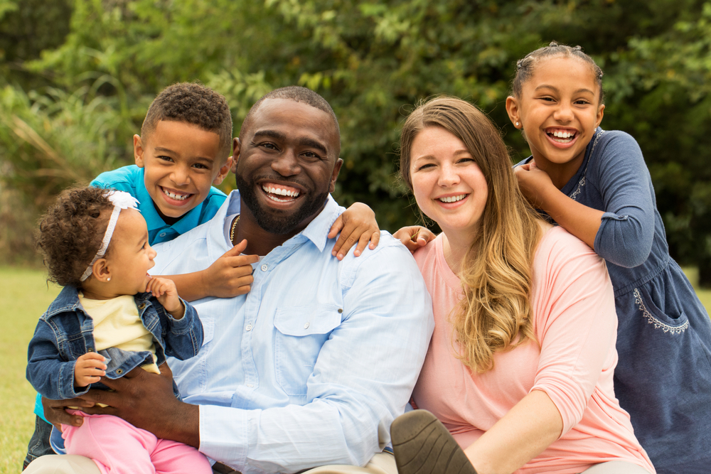 Beautiful smiling family with diverse skin tones