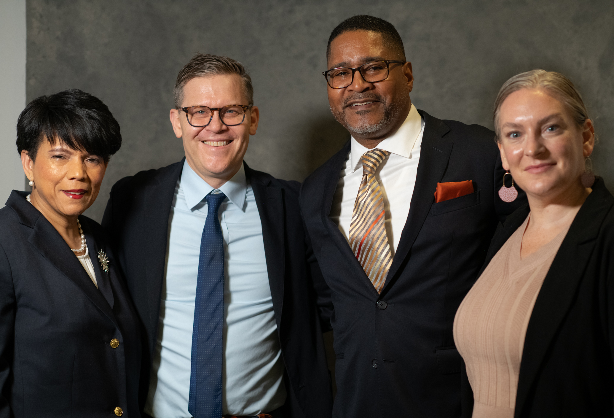 A group of ACS Commissioners and CCM senior leaders pose for a photo together.