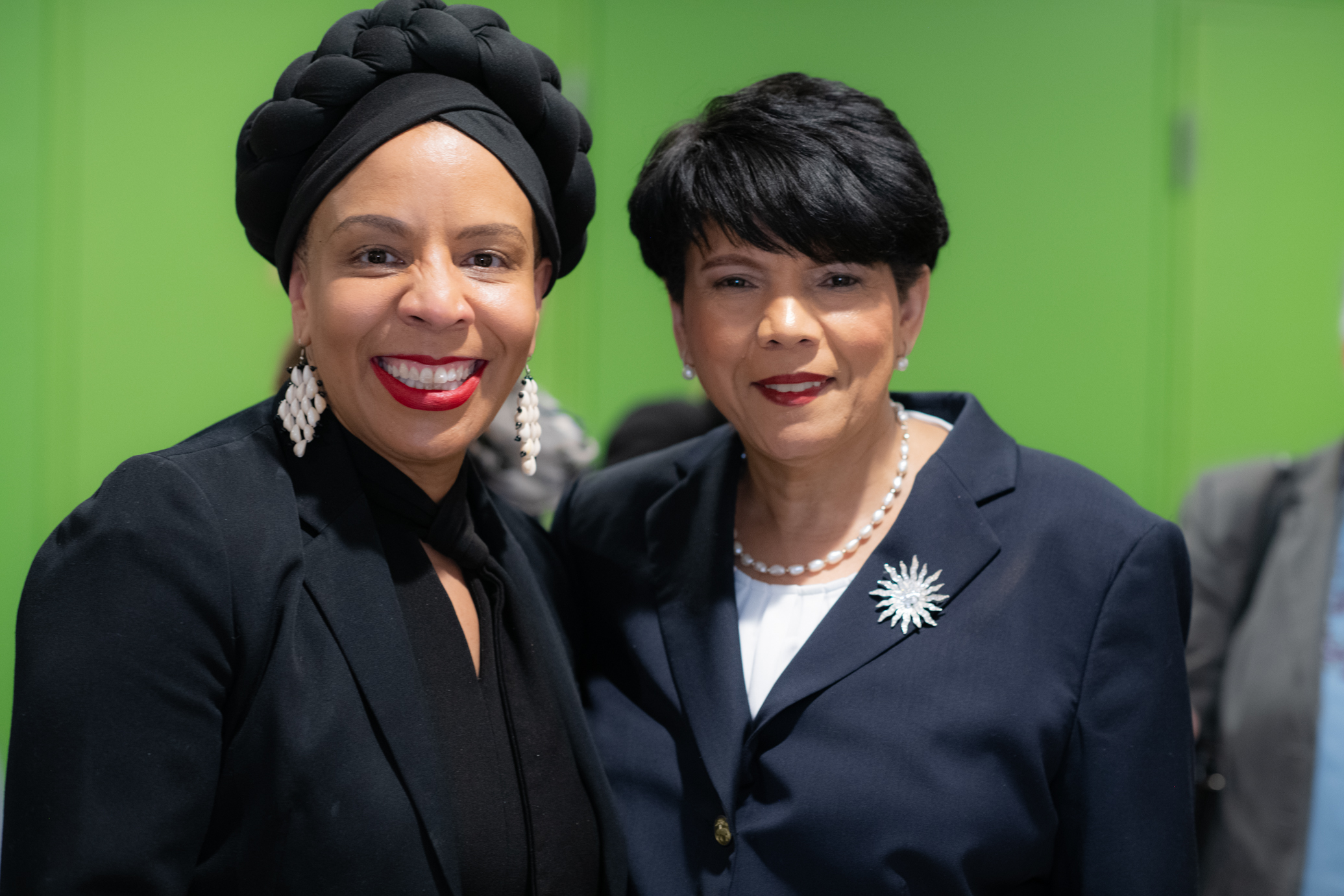 Commissioner Cumbo and Carmen Collado smile while posing for a photo together.